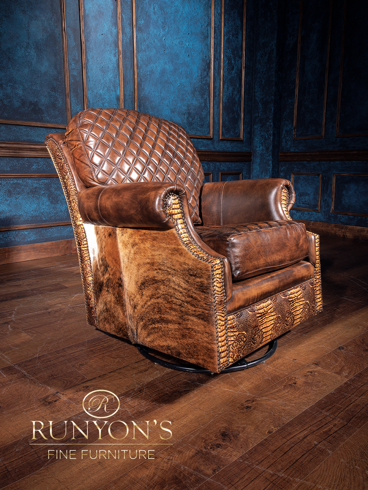 A brown quilted leather swivel chair with diamond stitch pattern, displayed in a room with blue walls.