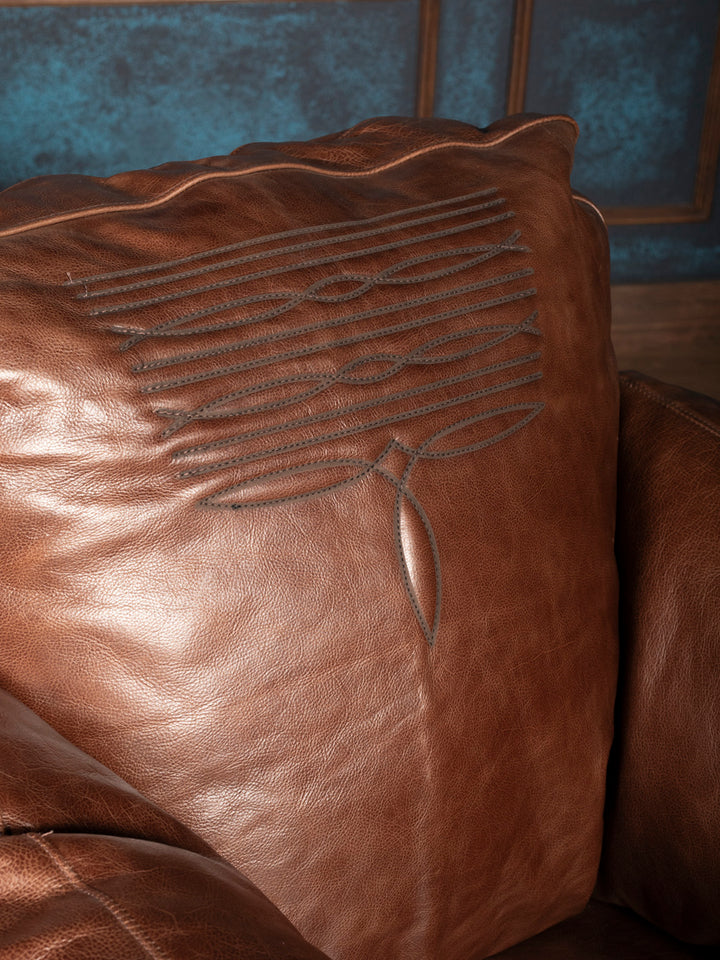 Close-up of Western boot-stitch embroidery on leather back pillow