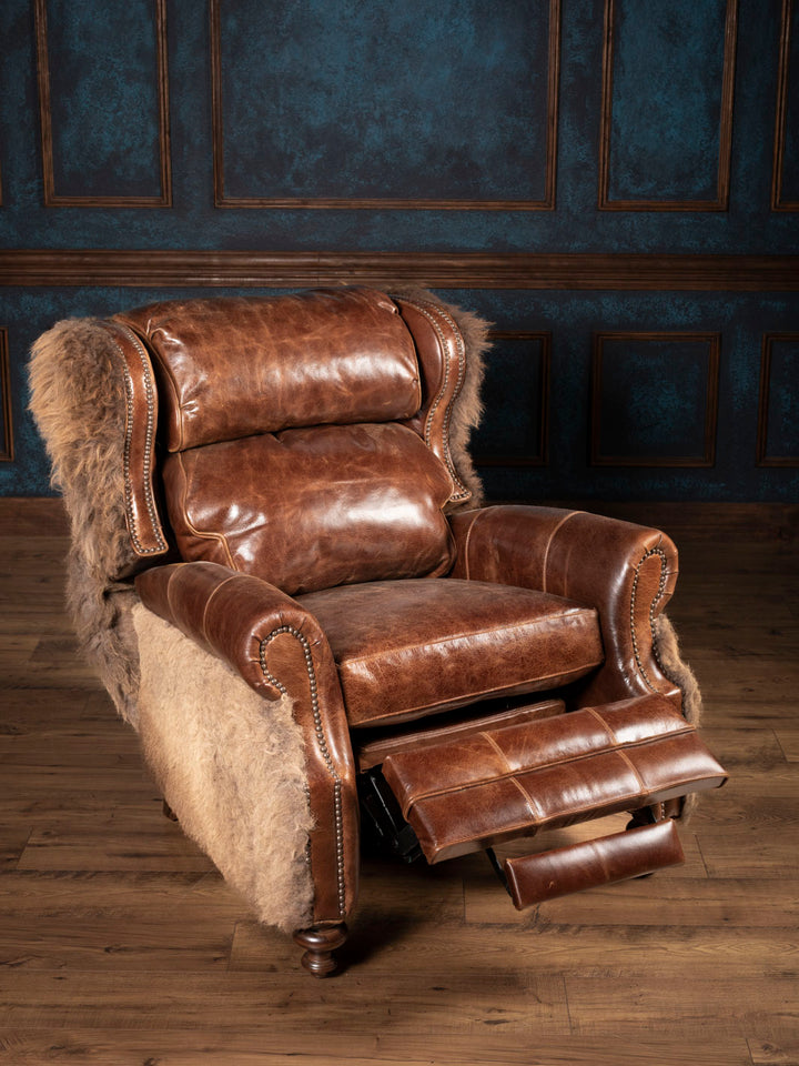 Reclined brown leather chair with hair on hide accents.