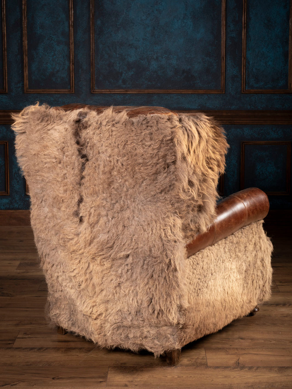 Leather recliner wrapped in buffalo hair on hide accents on the outside back and arms