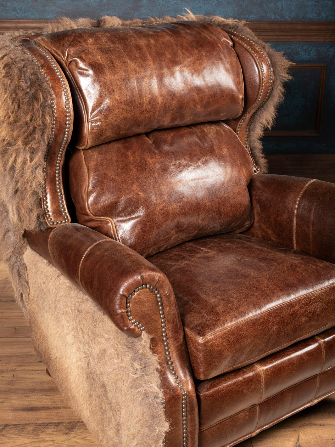 Brown leather recliner seat cushion and back cushion with hair on hide accents