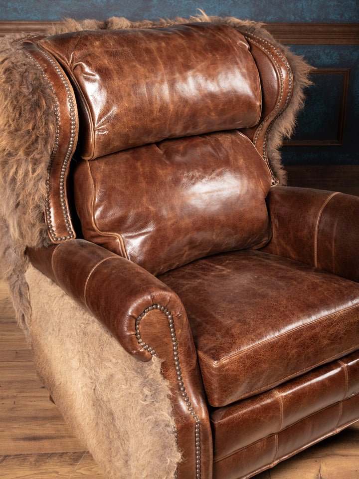 Brown leather recliner seat cushion and back cushion with hair on hide accents
