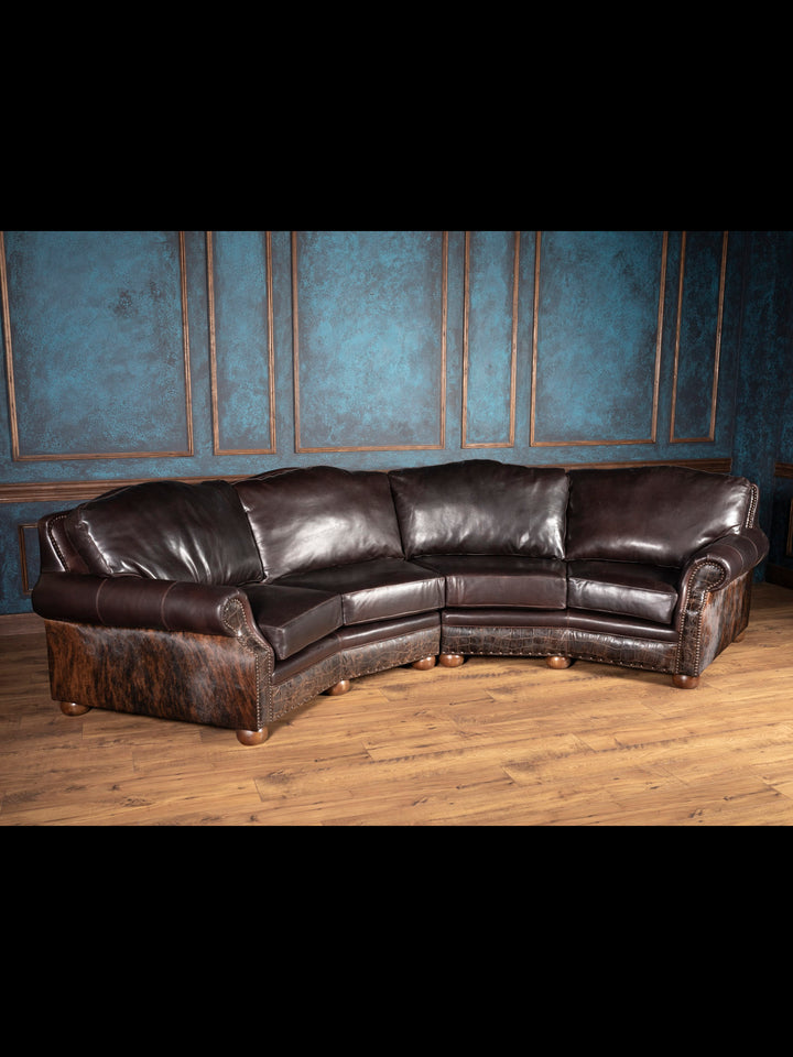 Handcrafted Western leather sectional with cowhide, bun feet, and curved silhouette in brown leather