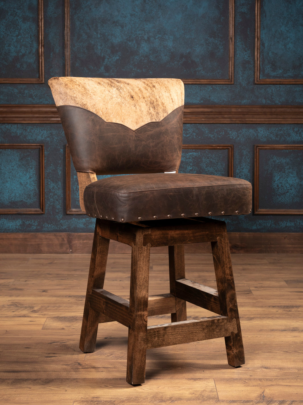 Desert Canyon Hide and Leather Swivel Bar Stool with cowhide backrest and brown leather seat