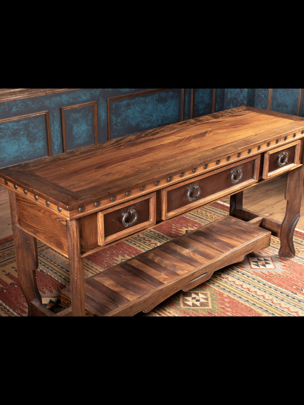 Wooden console table with drawers on a patterned rug