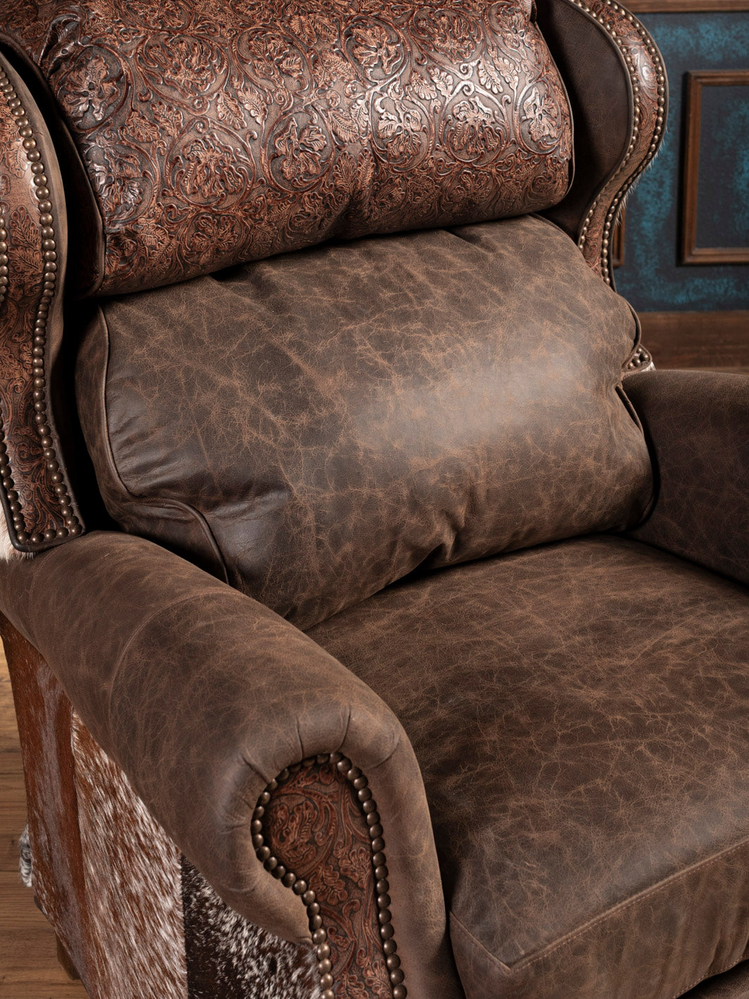Brown leather recliner chair with intricate patterns and textures.