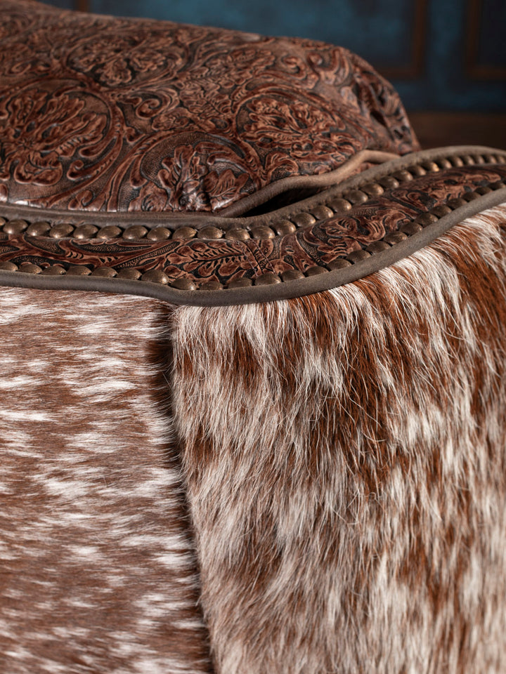 Close-up of a brown leather chair with cowhide