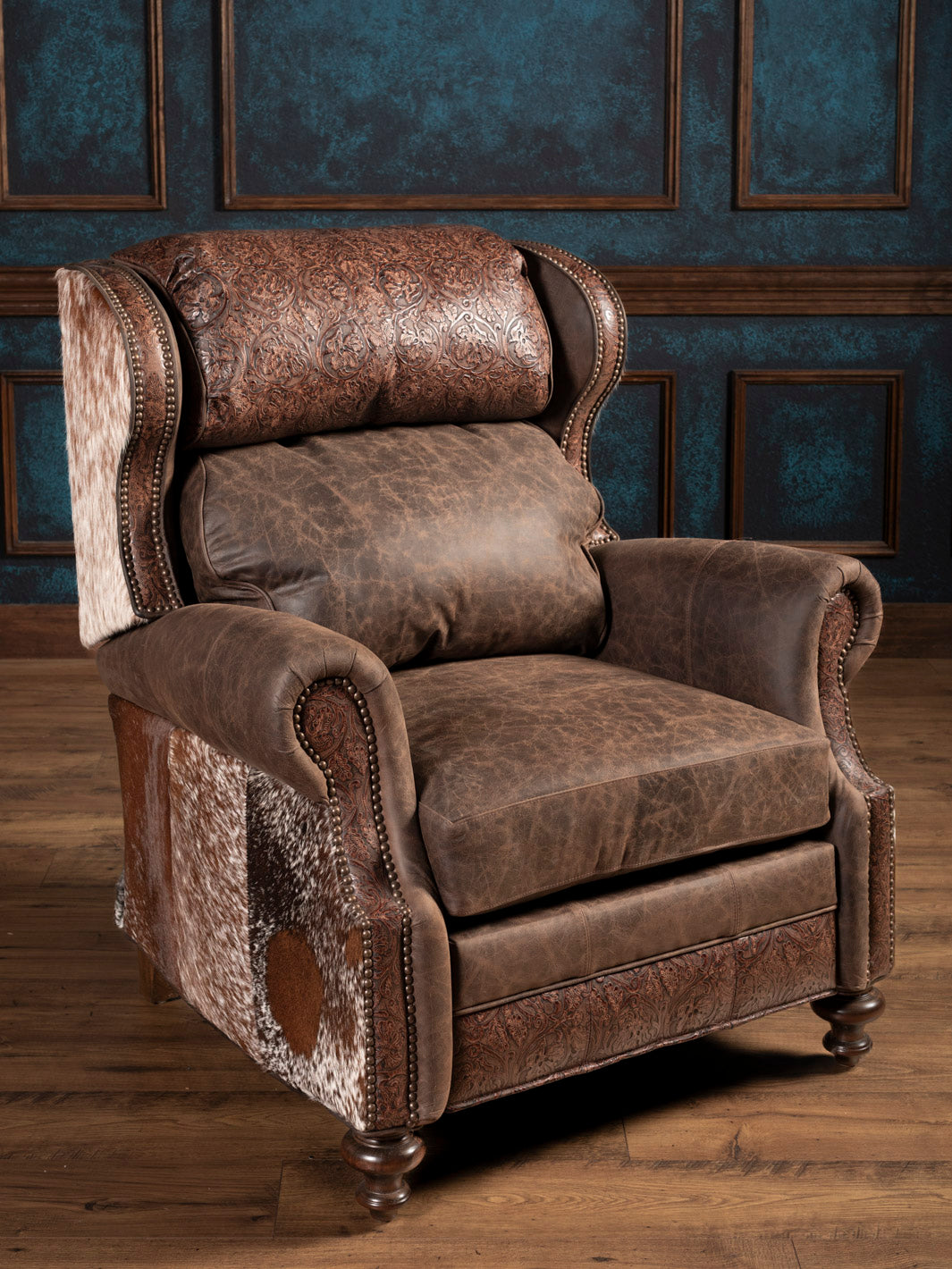 Front view of brown leather recliner with floral and cowhide accents