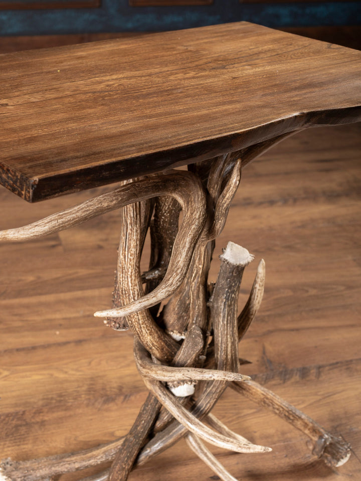Close up angle of antler table with wooden top