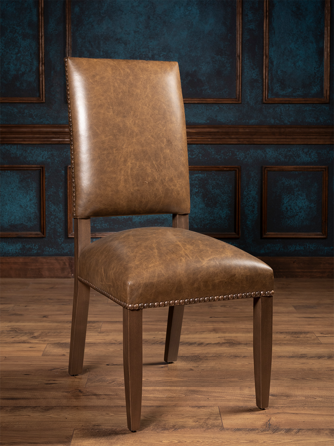 Full front view of the Everlast Leather Side Dining Chair with warm brown leather and nailhead trim