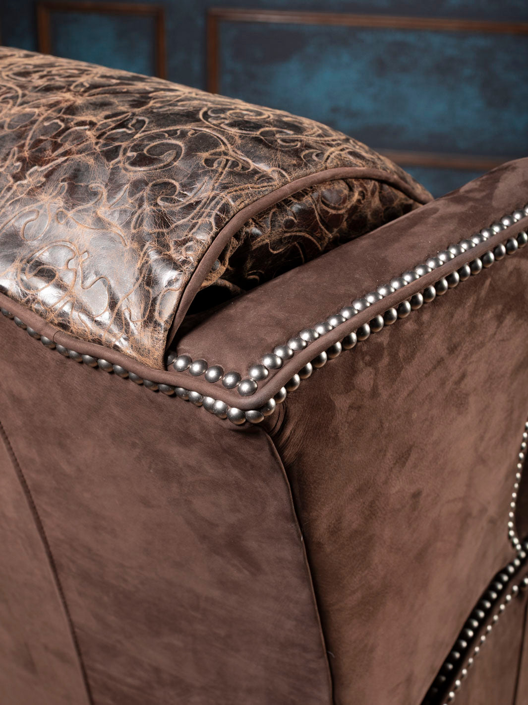 Close-up of brown leather recliner outside arm