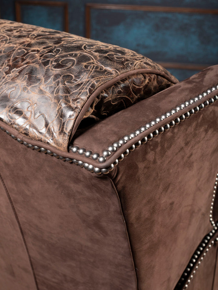 Close-up of brown leather recliner outside arm