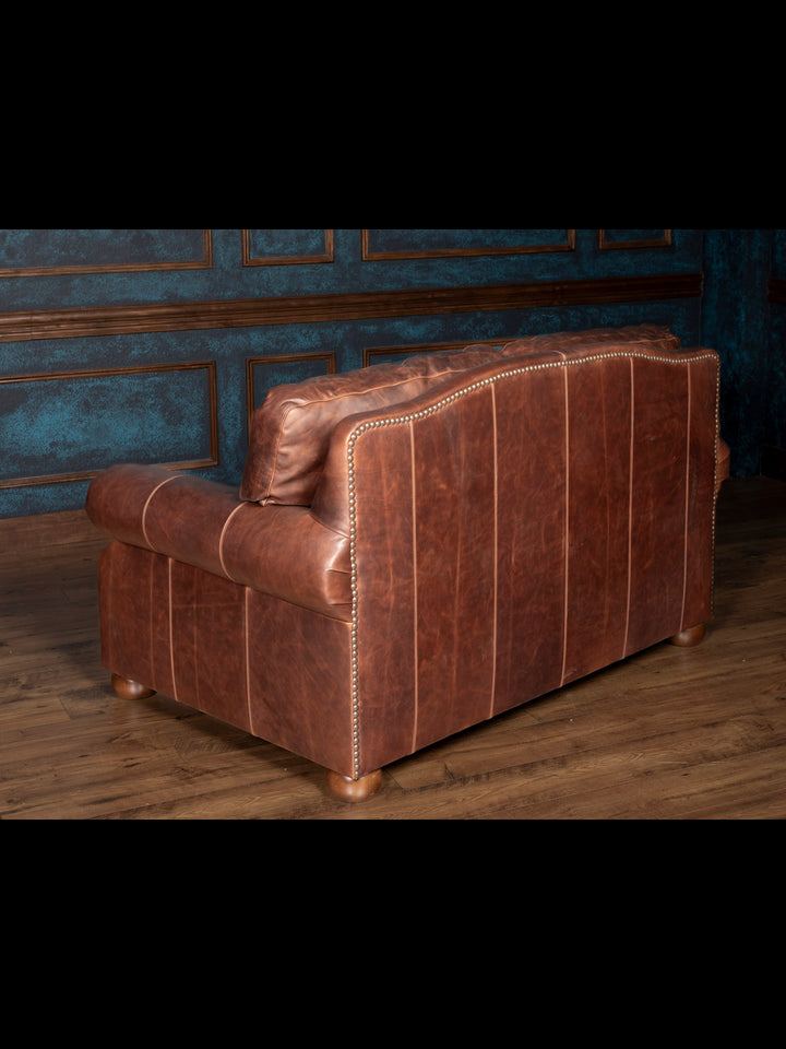 Angled back and side view of the leather sofa