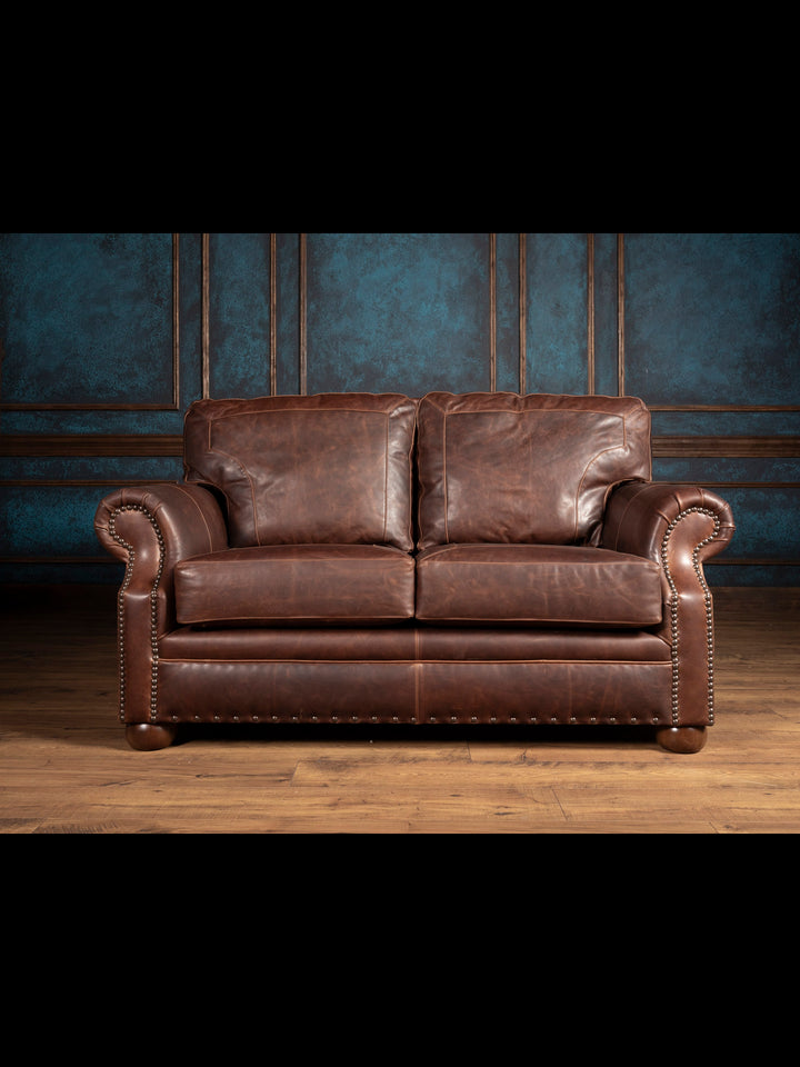 Framed Red Oak Leather Loveseat – Full front view of brown leather sofa with rolled arms
