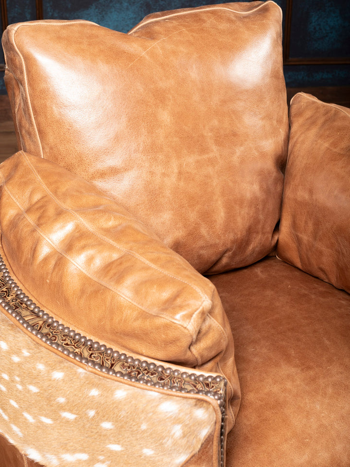 Front angle of Haven Axis Leather Recliner showing full-grain leather, Axis hide sides, and tooled base – Western luxury design
