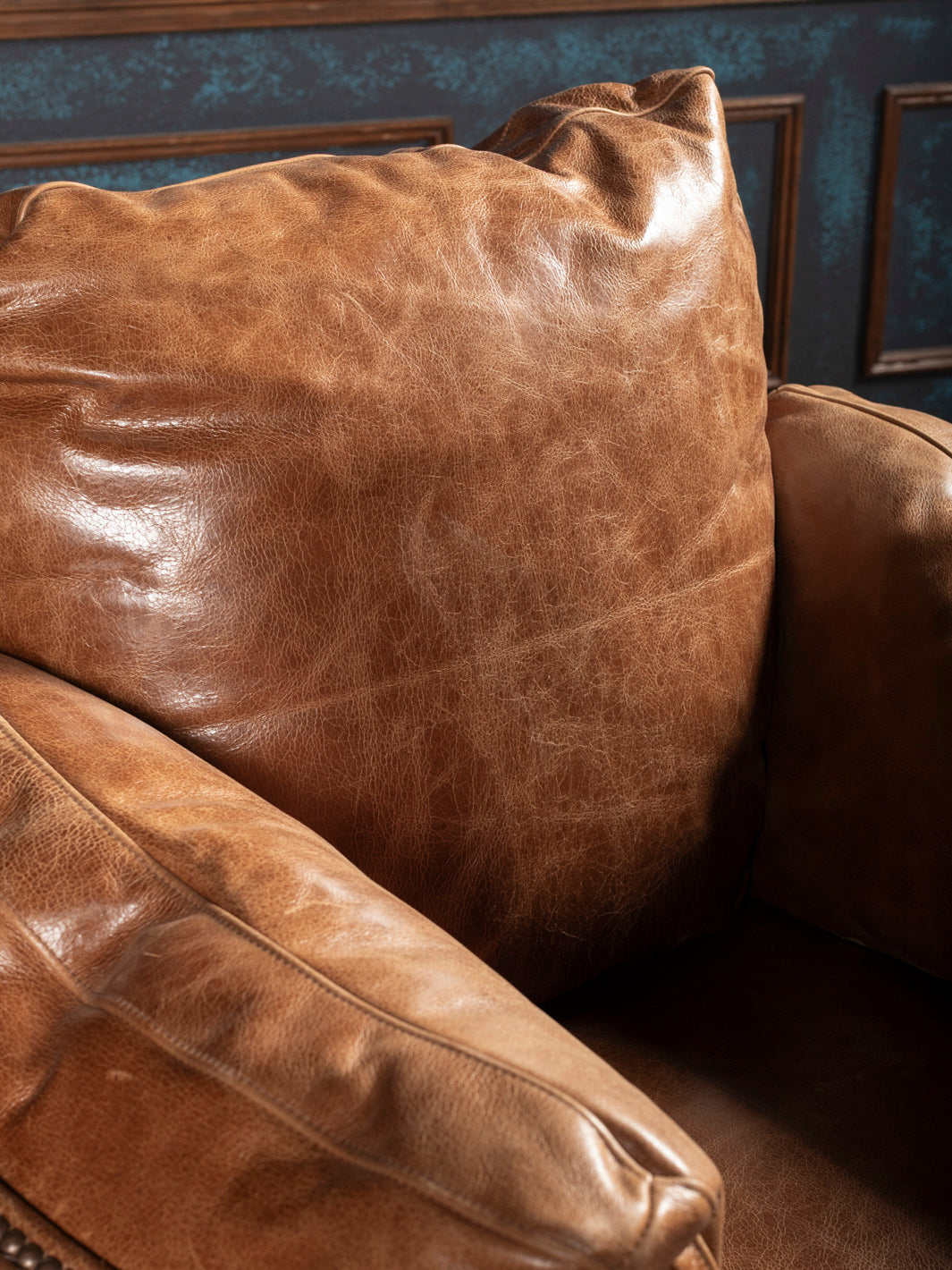 Back cushion and arm detail on Hill Country Axis Recliner: Plush leather cushion and armrest in buttery soft top grain leather.