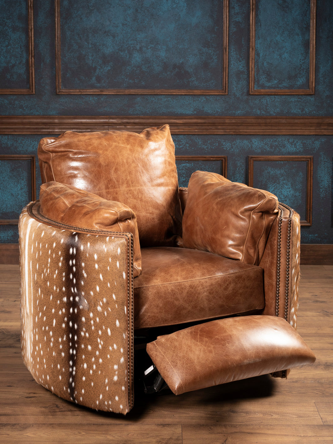 Recliner in full recline position Recliner shown extended with visible leather footrest and cozy structure.