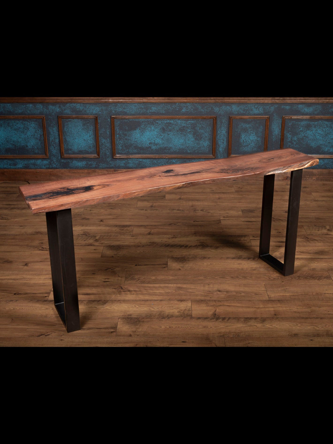 Sofa table with steel leg base and live edge top.