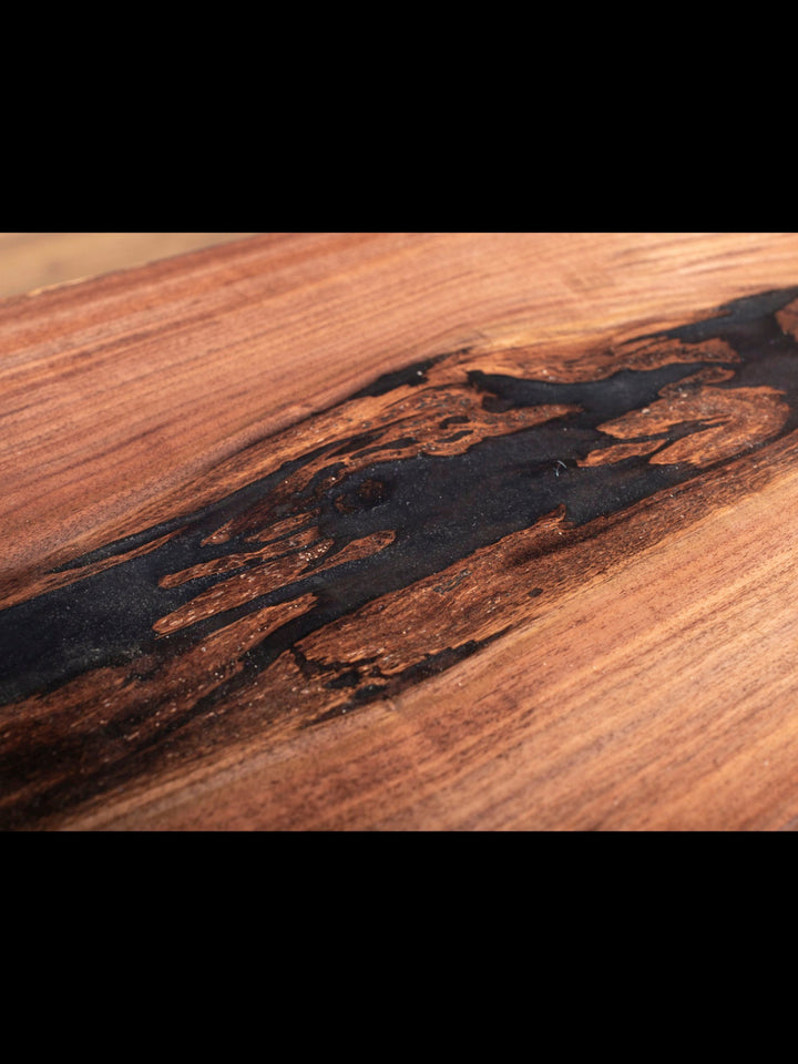 Close-up of black walnut inlay on sofa table.