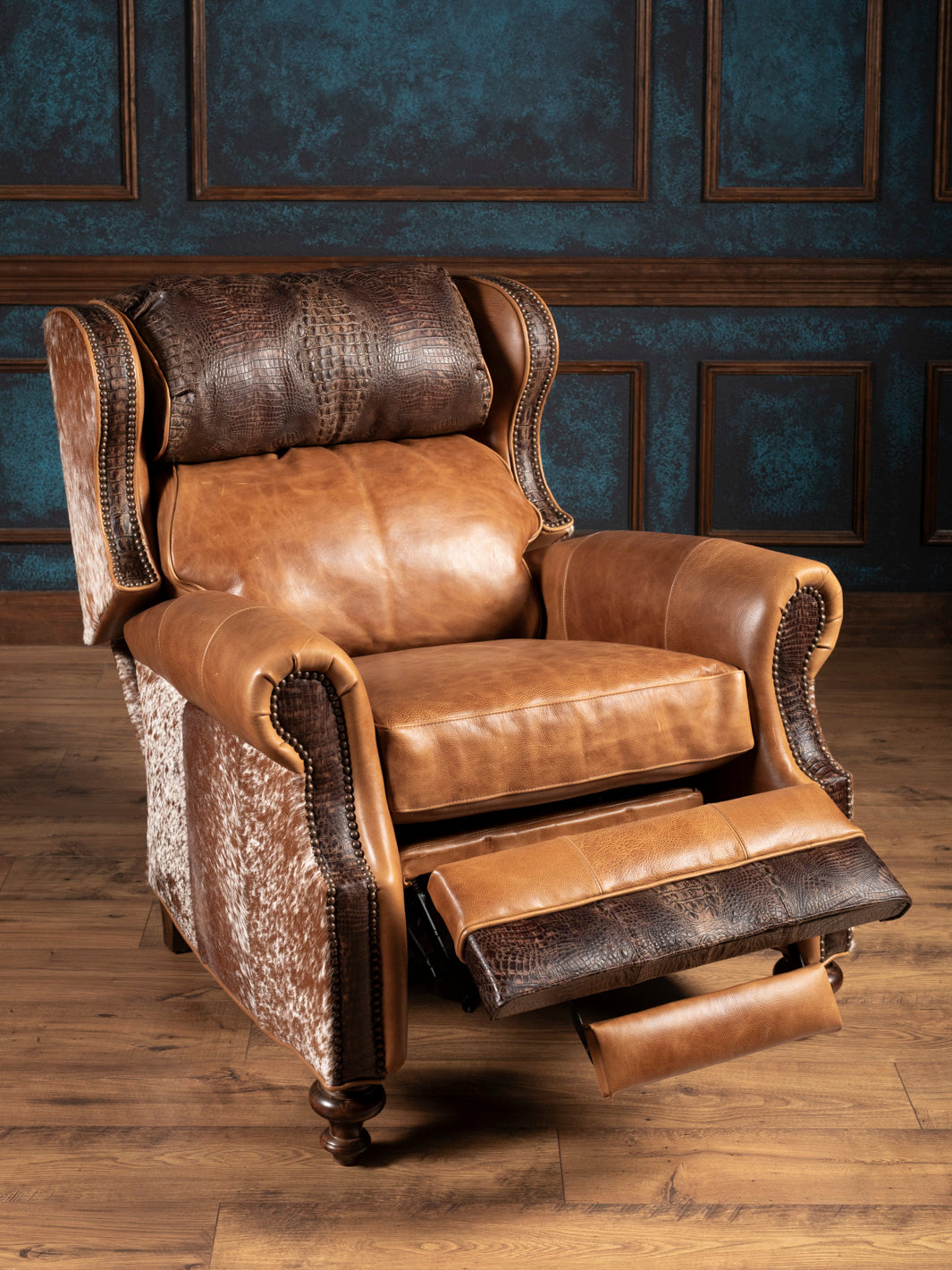 Full product image of Longhorn Leather Bronco Recliner in open position, featuring footrest with crocodile-embossed leather and saddle leather seat.