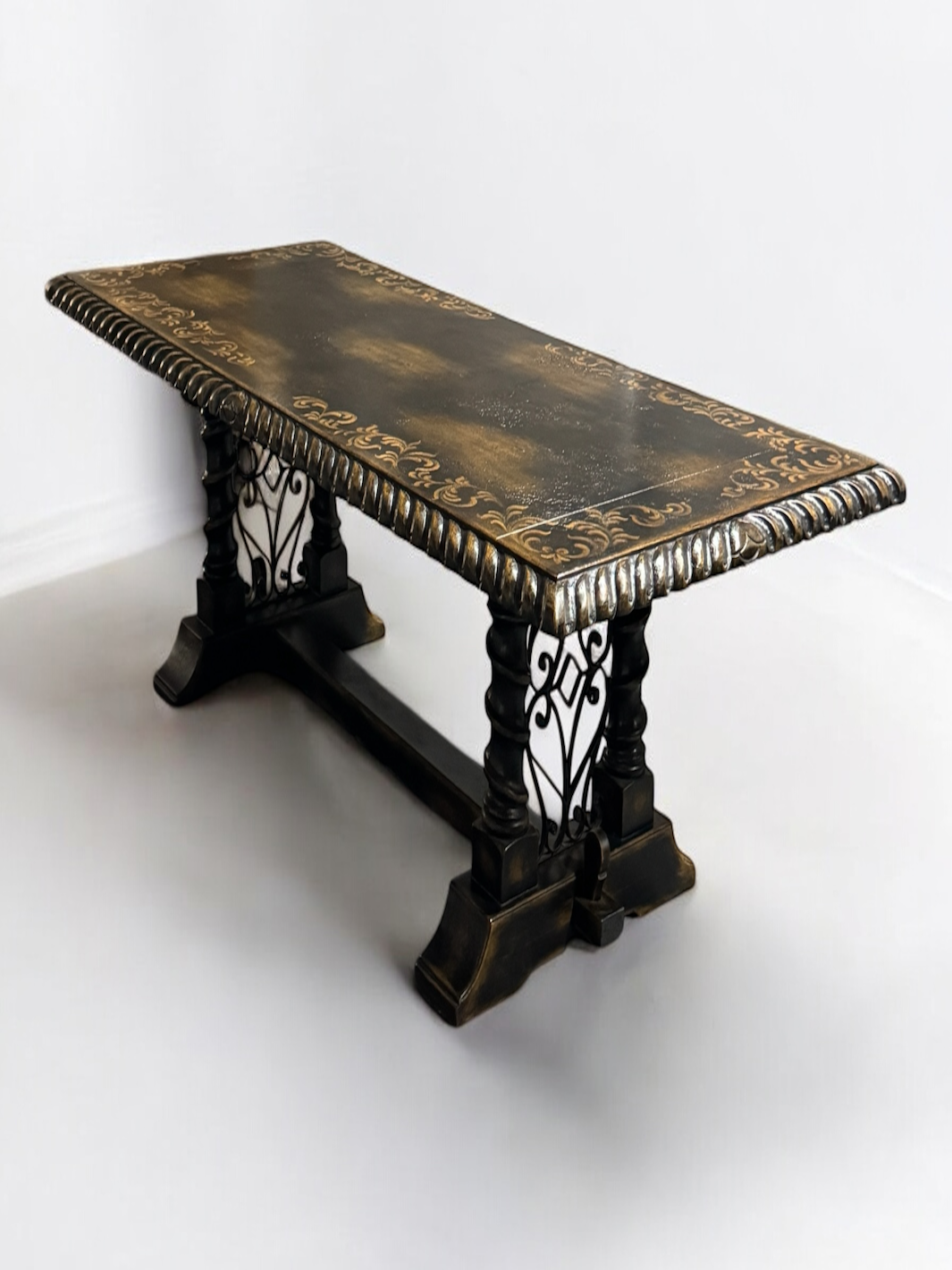 Decorative wooden table with intricate carvings on a white background