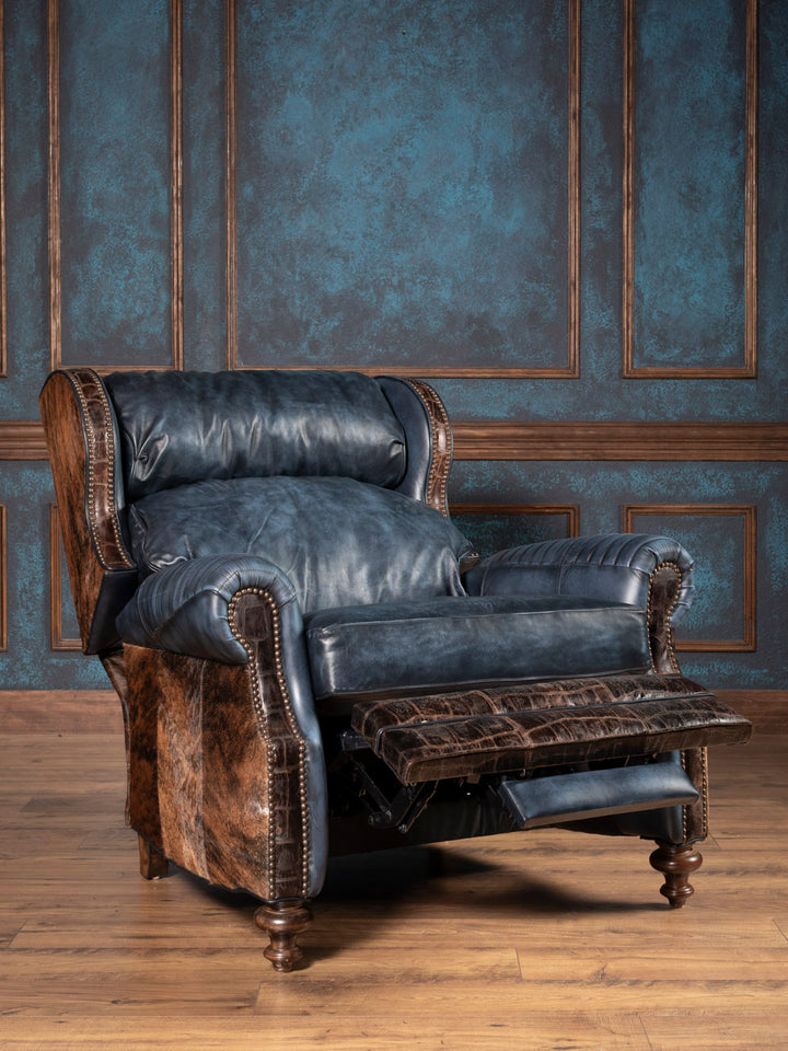 Luxury cowhide and leather recliner fully extended, with rich blue leather and embossed leather footrest in rustic Western style