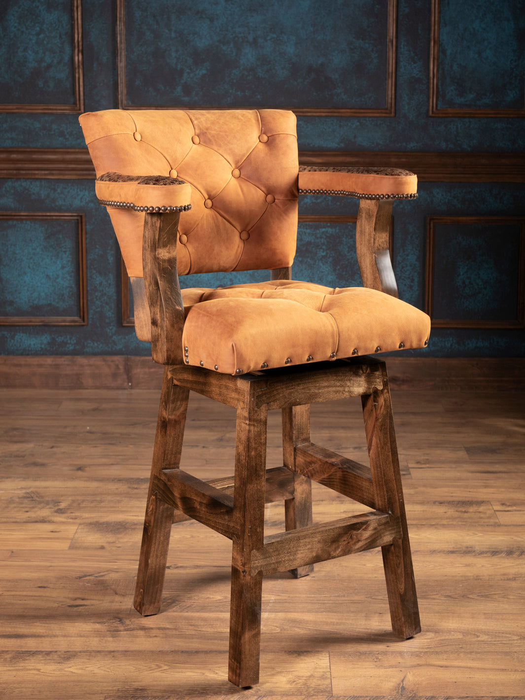 Ostrich leather bar stool front view with tufted seat and swivel base