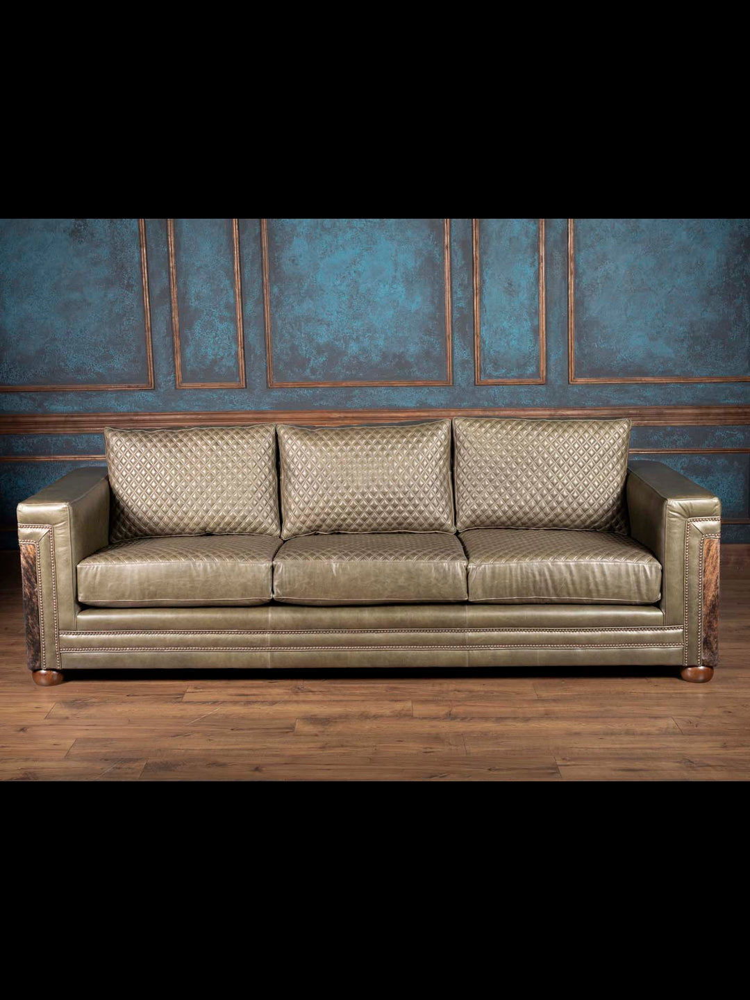Quilted Green Western leather sofa with cowhide panels front view and diamond quilted cushions
