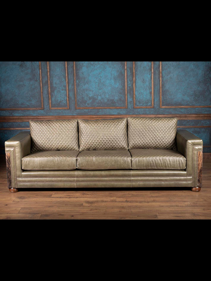 Quilted Green Western leather sofa with cowhide panels front view and diamond quilted cushions