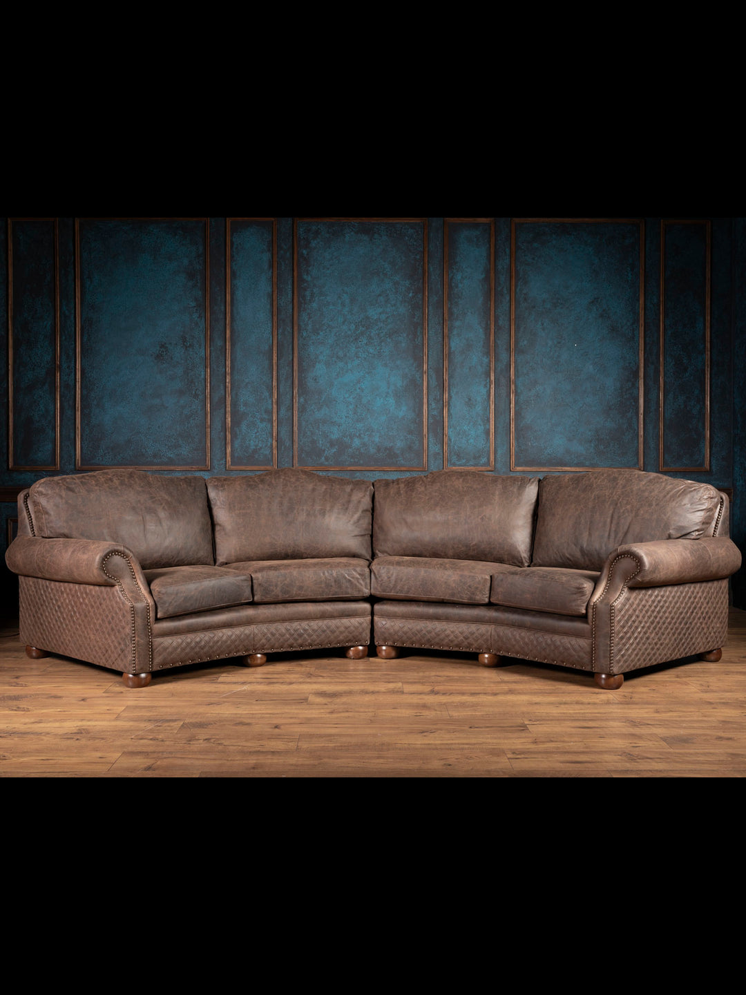 Brown leather sectional sofa with four cushions and diamond quilted accents