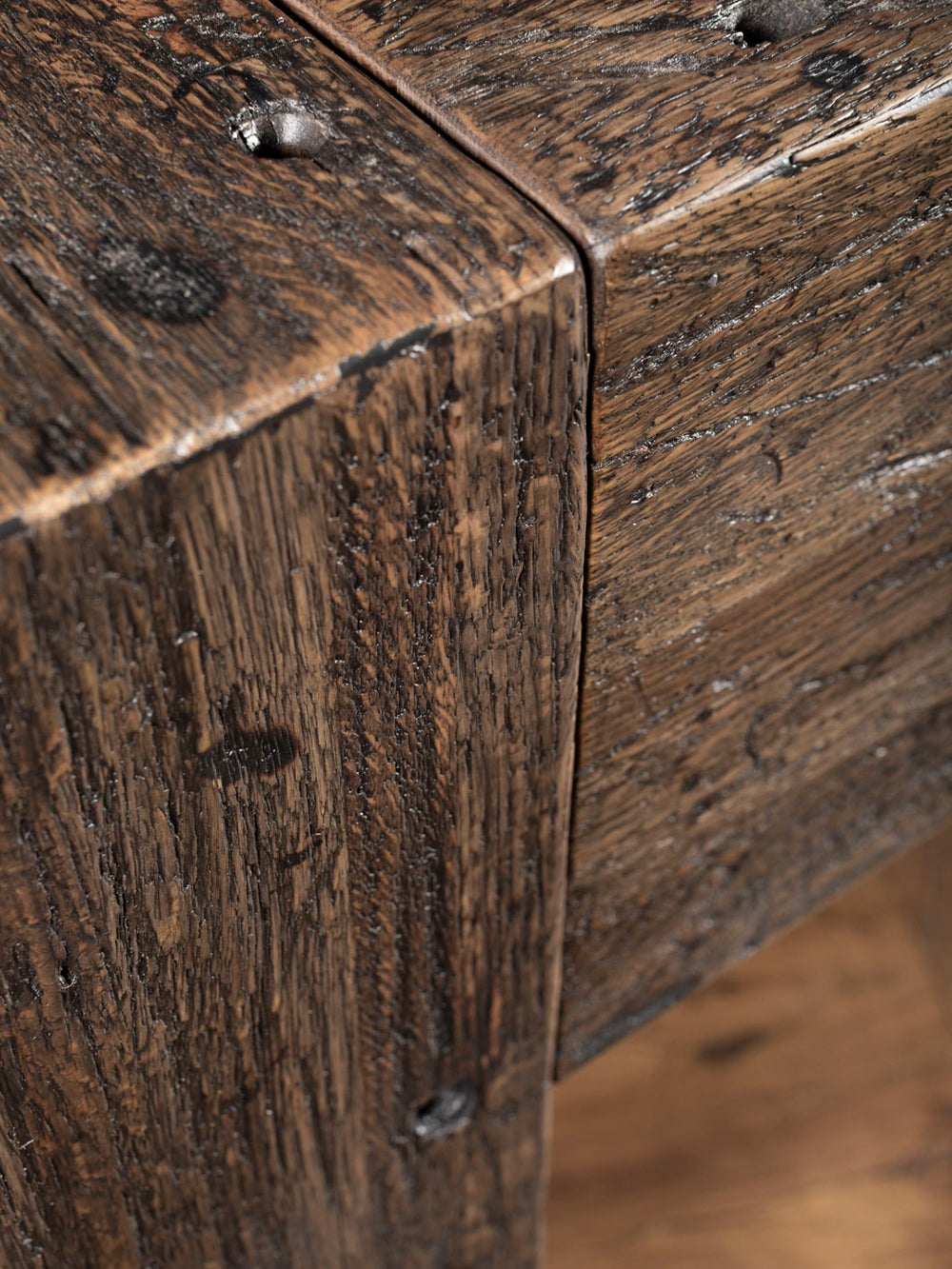 Close up of distressed wood console