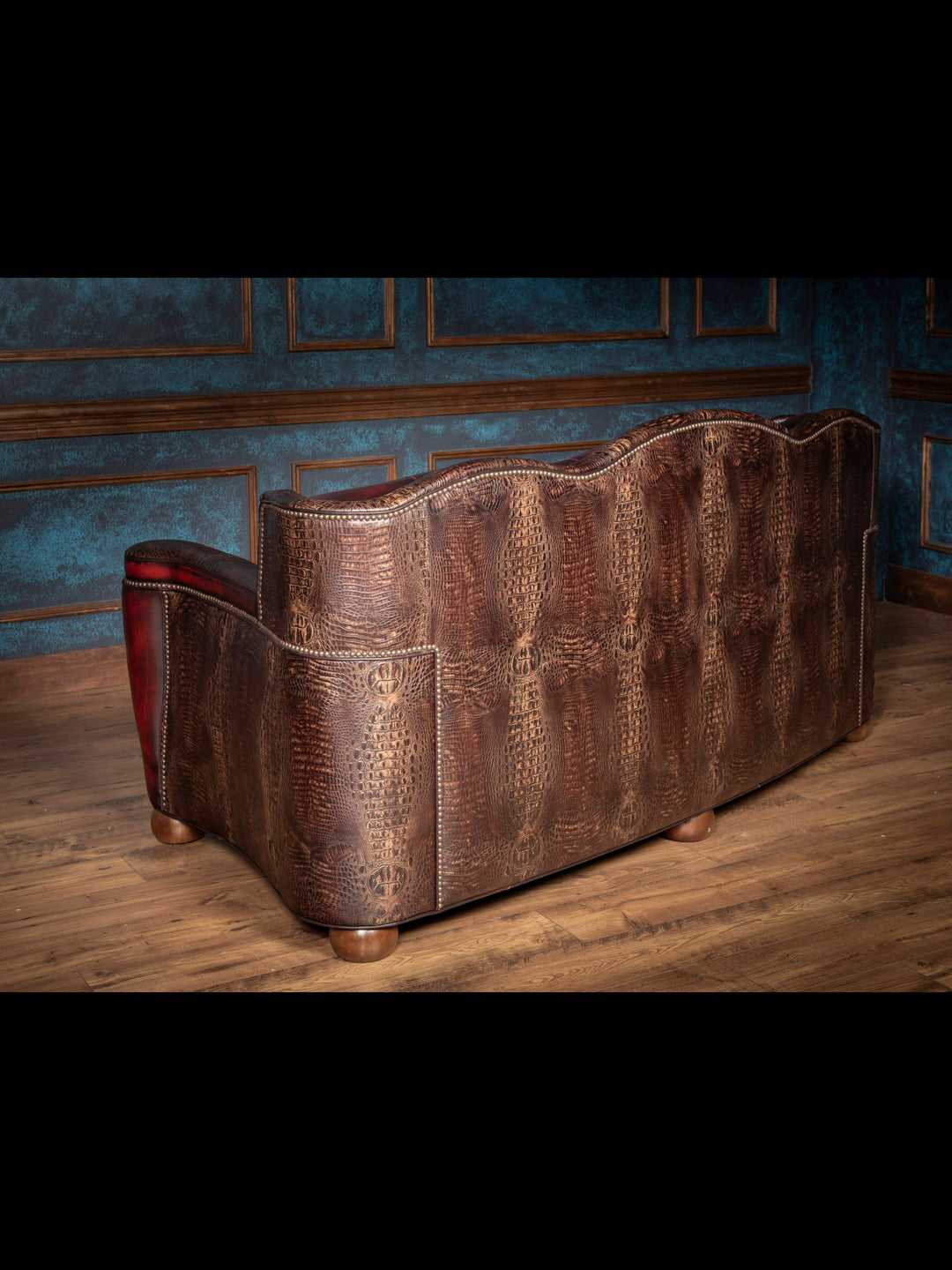 Western loveseat sofa in rich red full-grain leather with crocodile accents – lodge style two-seater