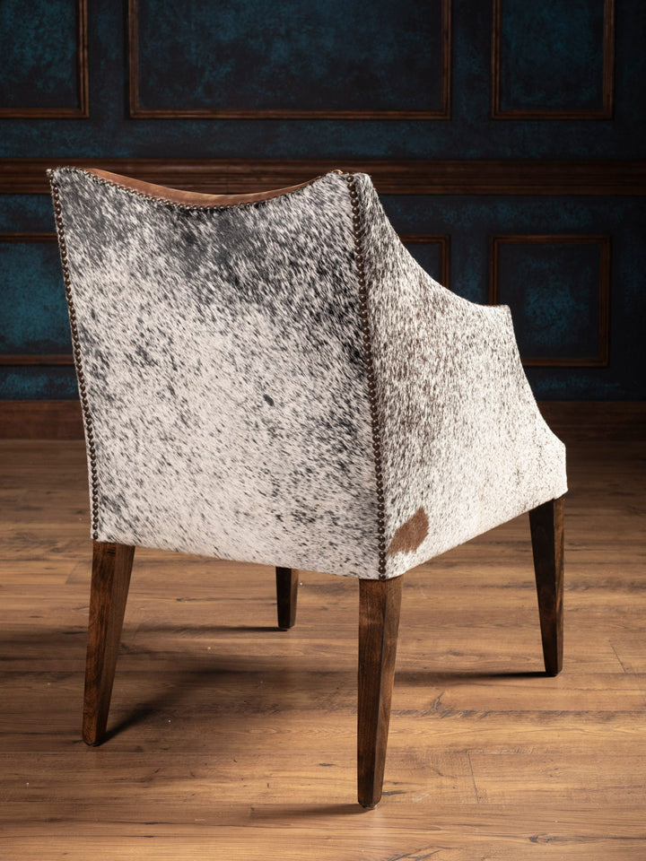 Speckled cowhide back on handcrafted Ridgecut arm chair with bold Western style