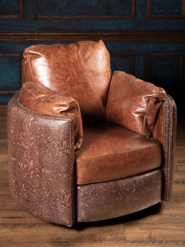 Full product image of Saddle Creek Tooled Leather Snug Swivel Recliner with saddle leather cushions and floral tooled leather panels.