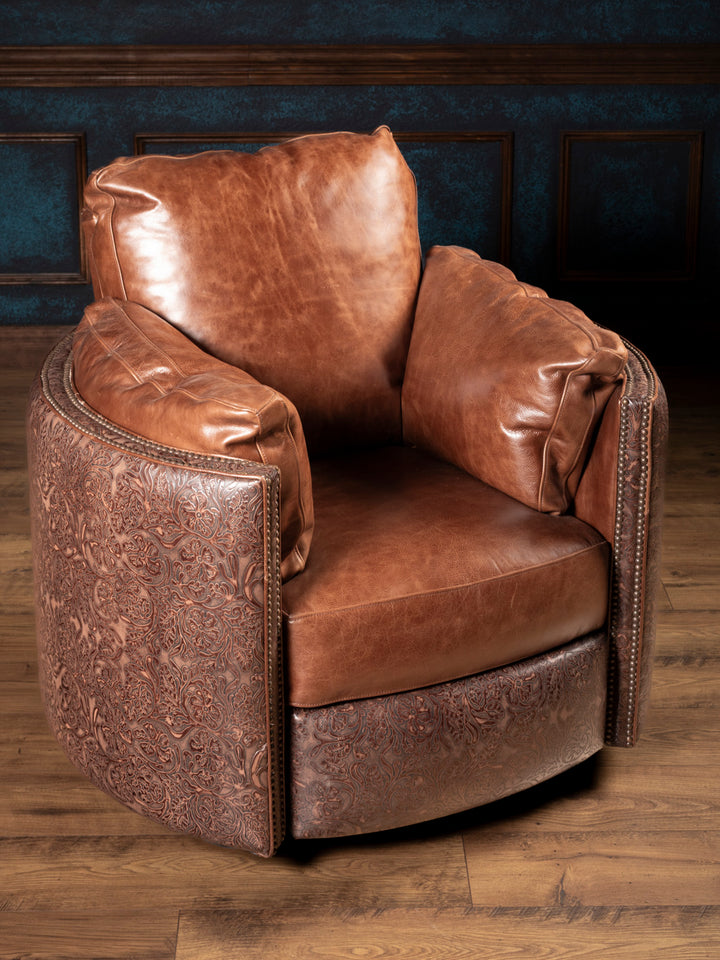 Full product image of Saddle Creek Tooled Leather Snug Swivel Recliner with saddle leather cushions and floral tooled leather panels.