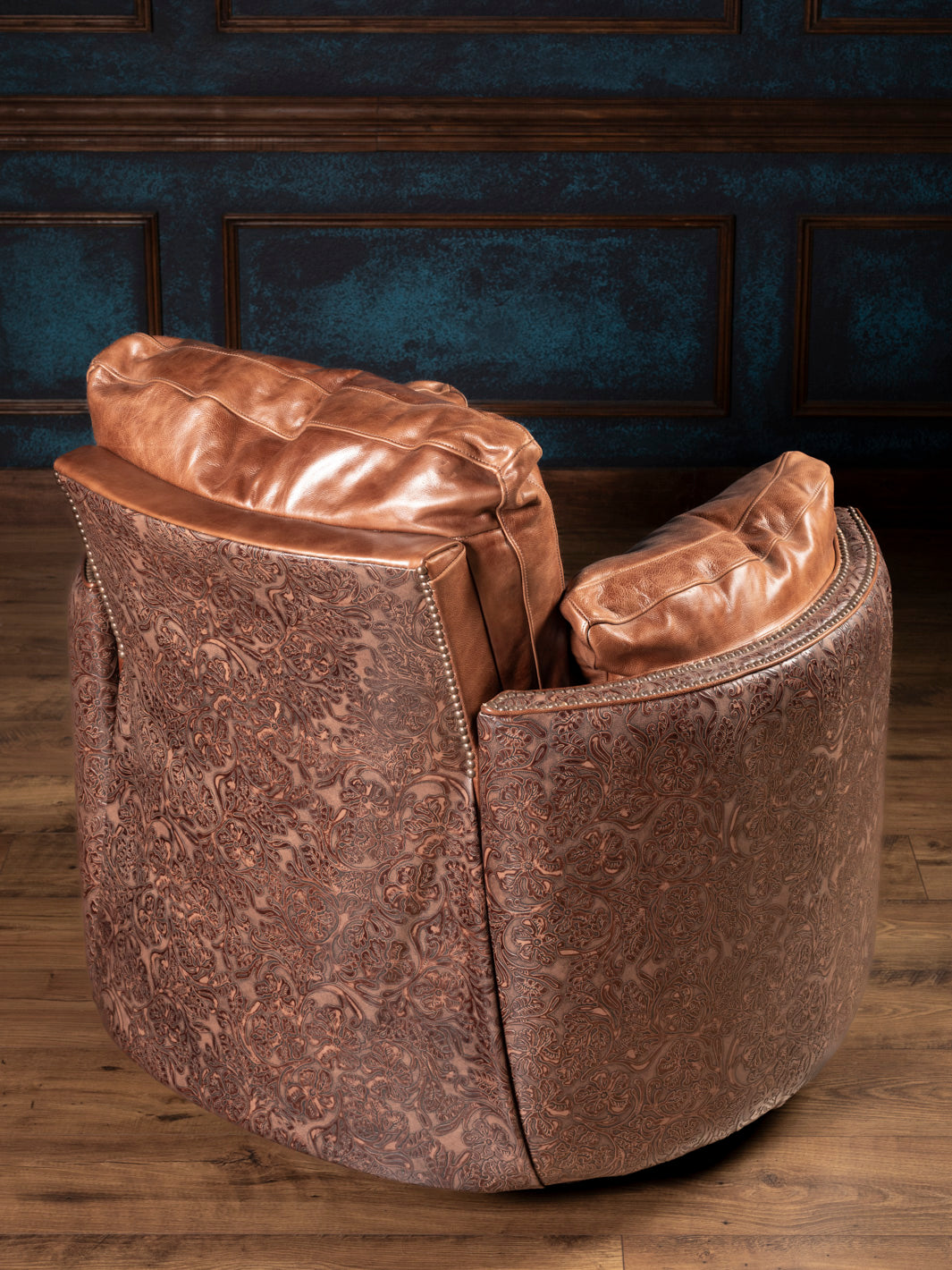 Rear view of Saddle Creek recliner featuring full tooled leather back, saddle leather cushions, and Western-style curves.