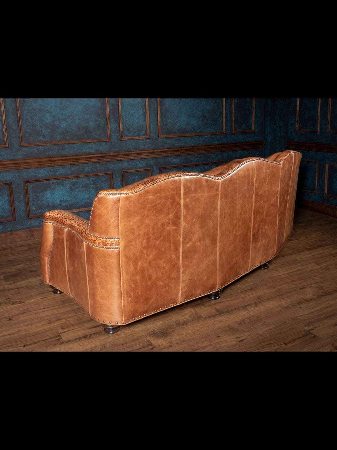 Back side of the brown leather sofa