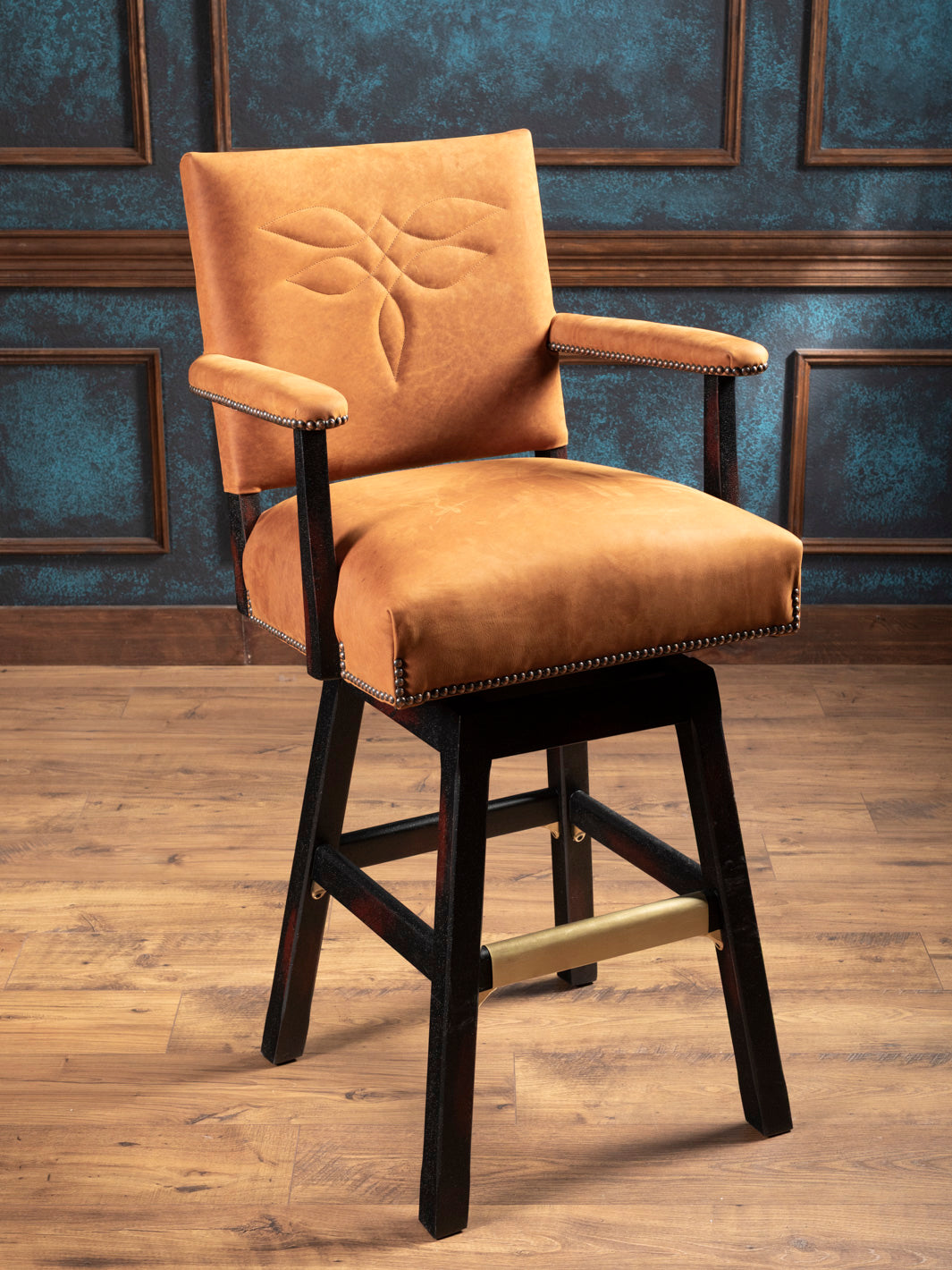 Front angle view of Sedona Saddle Leather Bar Stool with boot stitch pattern and nailhead trim