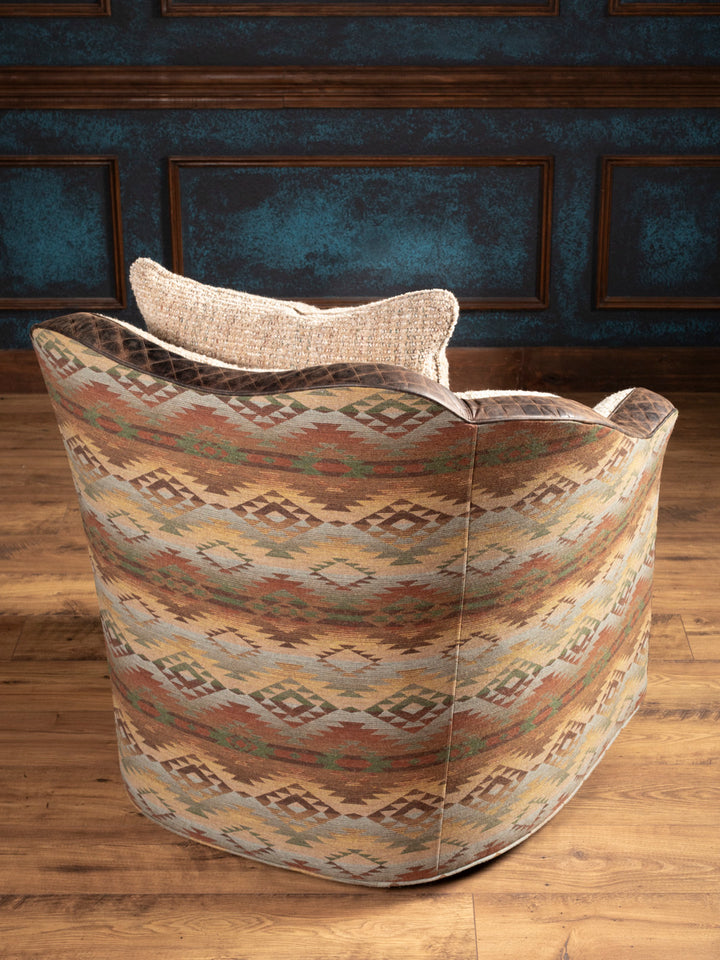 Back view: Back of swivel chair with Navajo-inspired woven fabric in earth tones