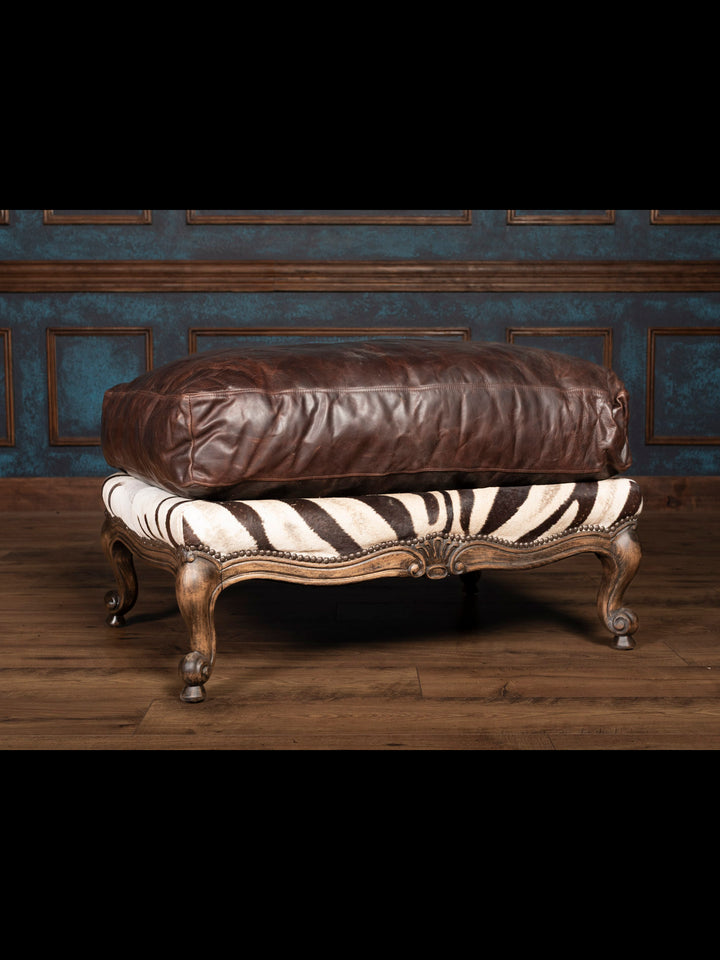 Luxury zebra leather ottoman with dark brown cushion and carved wood legs – handcrafted exotic furniture