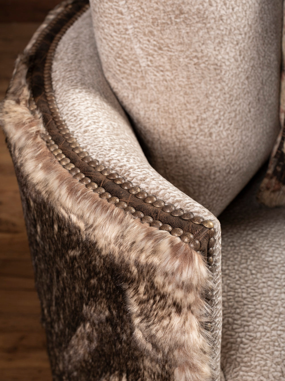 Close-up of fur panel and nailhead trim on Dyson Swivel Chair