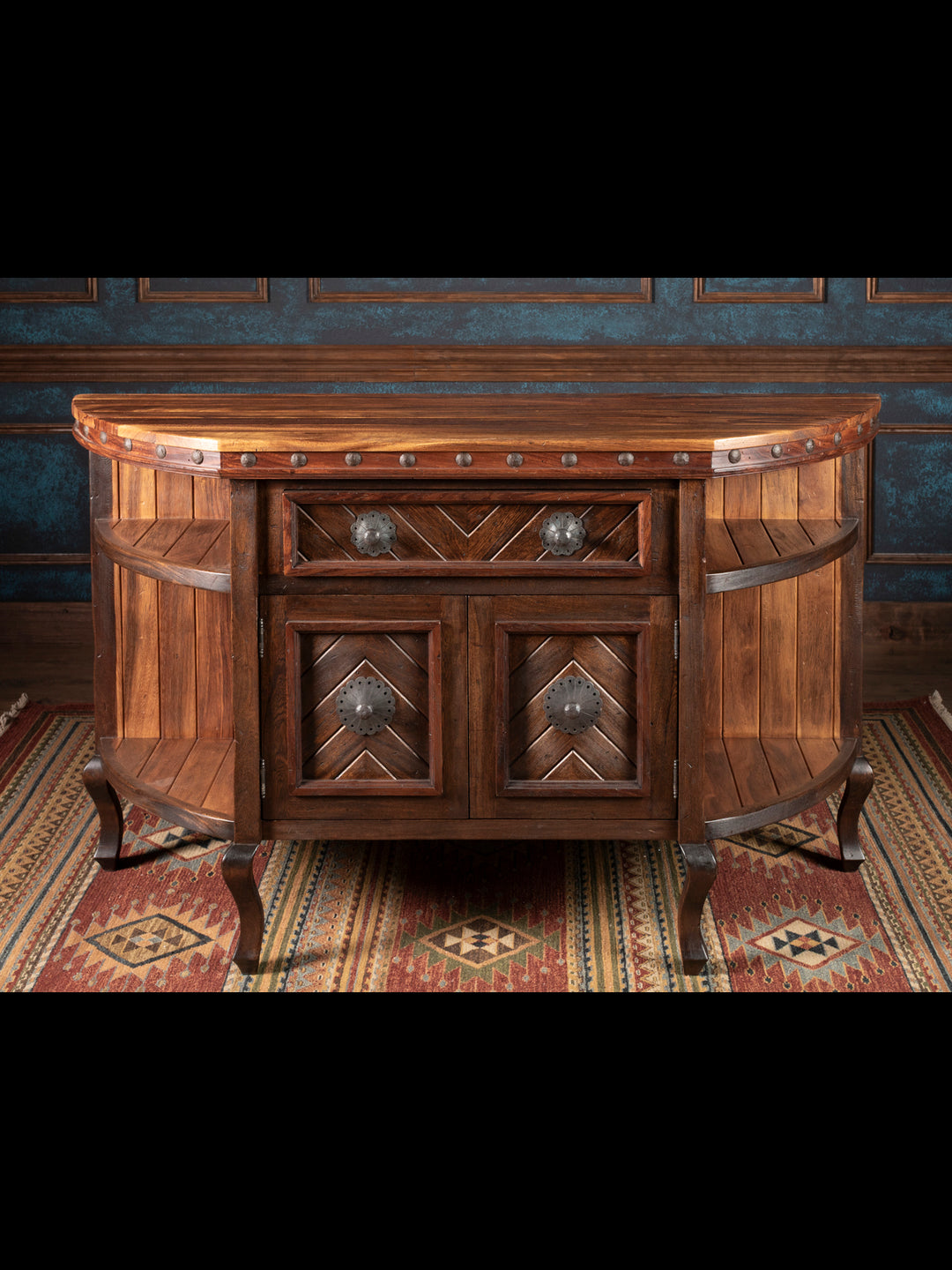 Wooden sideboard with decorative design on a patterned rug