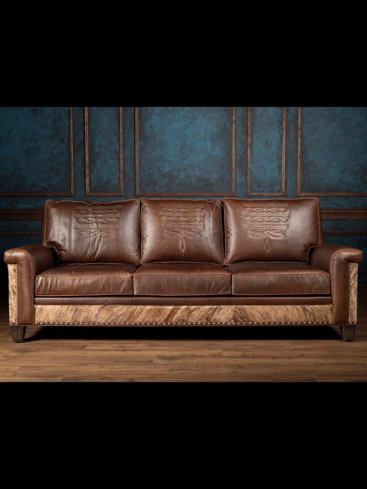 Western Heritage Leather Sofa with cowhide detailing in a western style living space.