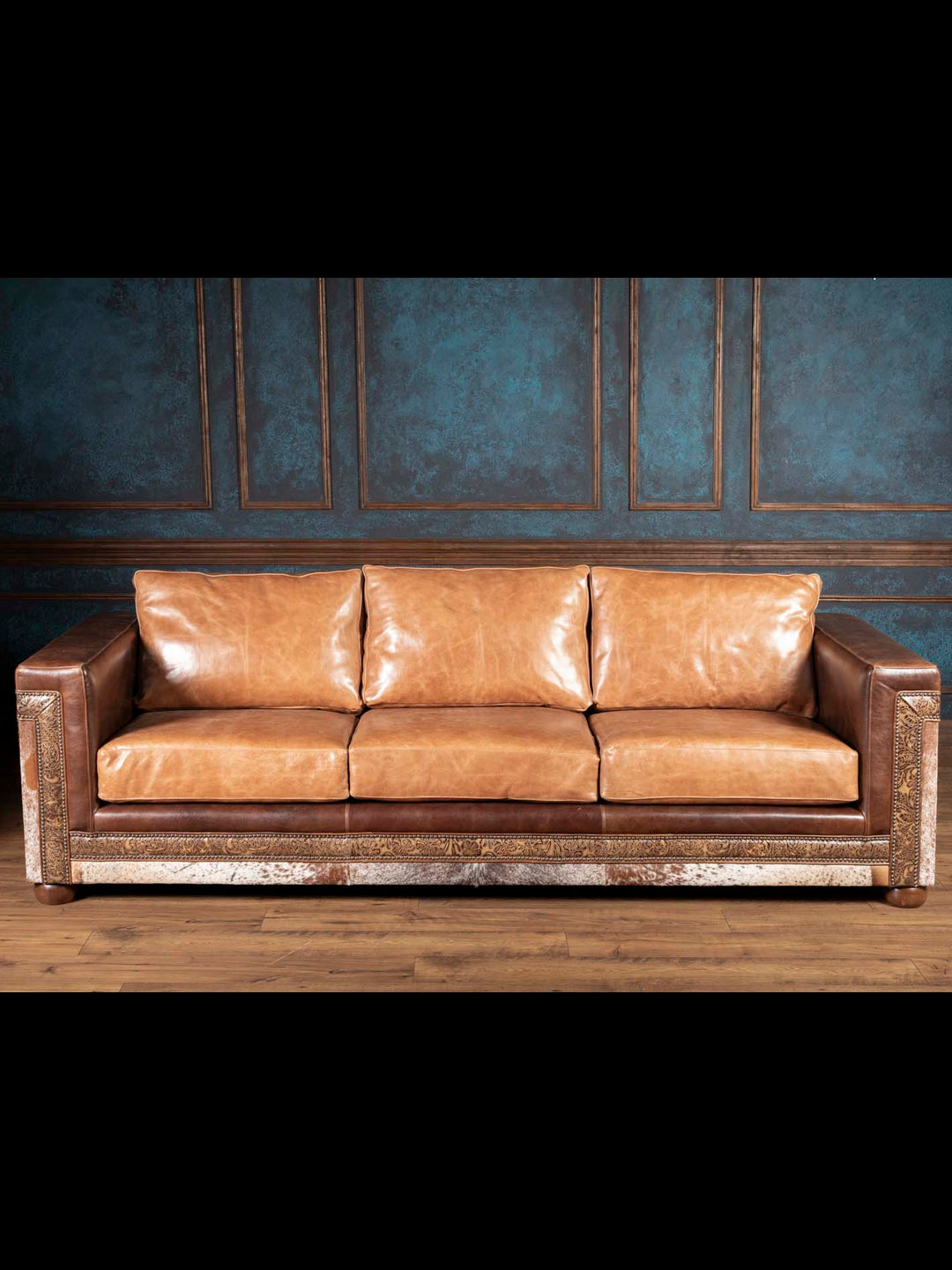 western leather sofa front view with cowhide base