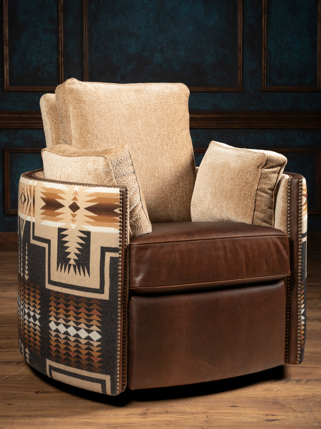 Front view of the Adobe Trail Western leather swivel glider recliner chair featuring a brown patina full-grain leather base, plush textured chenille seating cushions, and a southwestern geometric fabric outer wrap.
