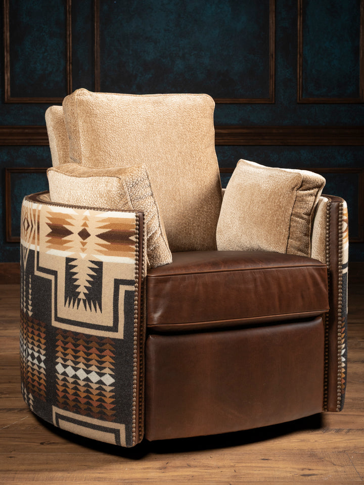 Front view of the Adobe Trail Western leather swivel glider recliner chair featuring a brown patina full-grain leather base, plush textured chenille seating cushions, and a southwestern geometric fabric outer wrap.