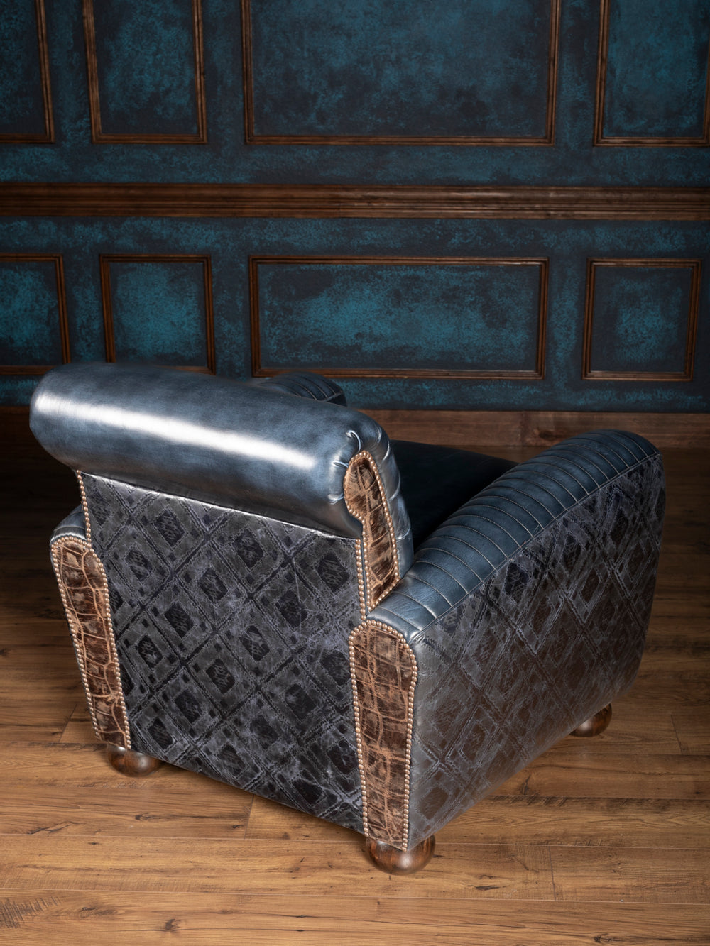 Blue Leather Cigar Chair with embossed diamond leather back panels and crocodile leather trim in a western living space.
