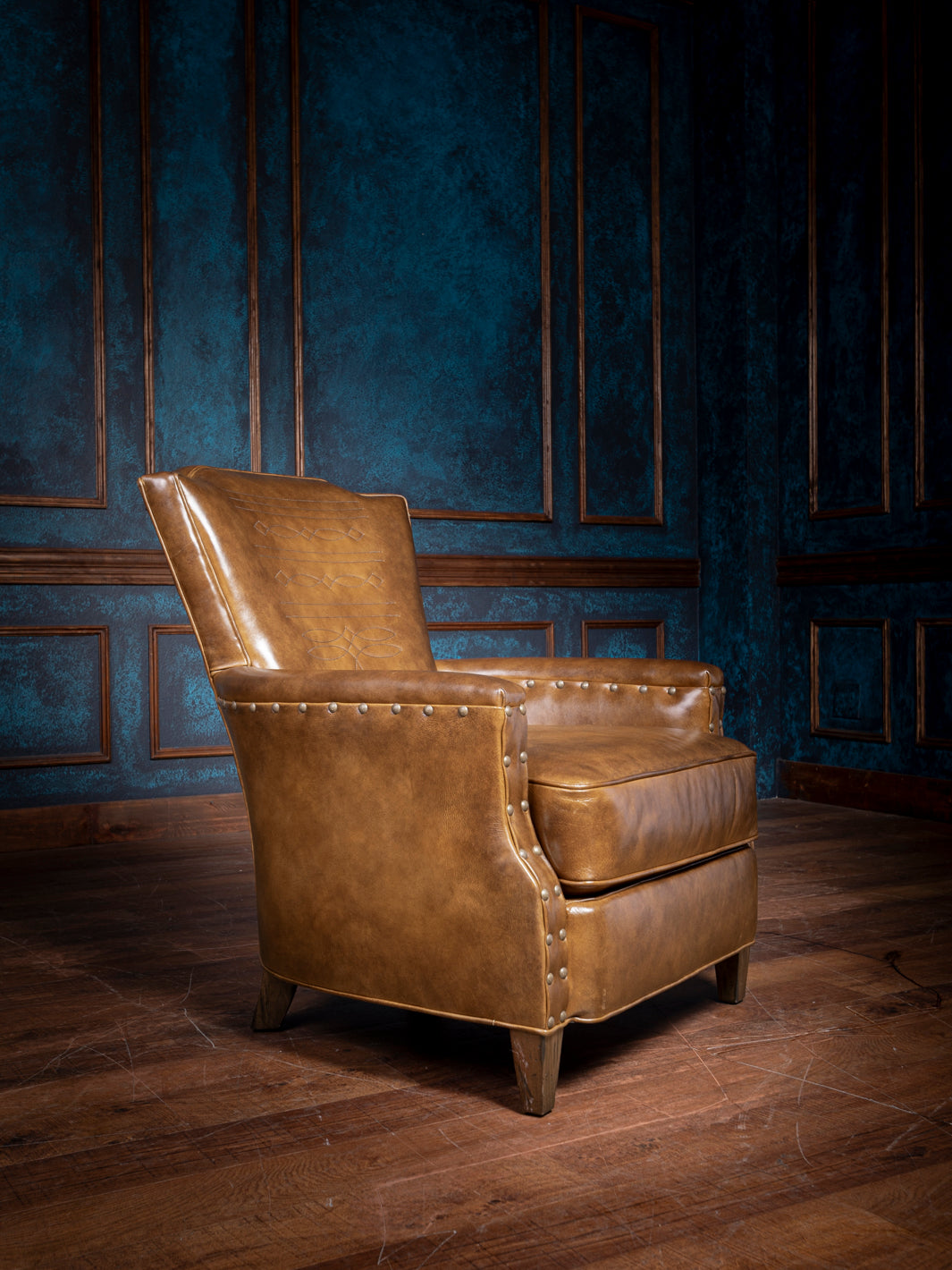Bourbon Stitch Leather Accent Chair in full-grain brown leather with nailhead trim, styled in a Western living space.
