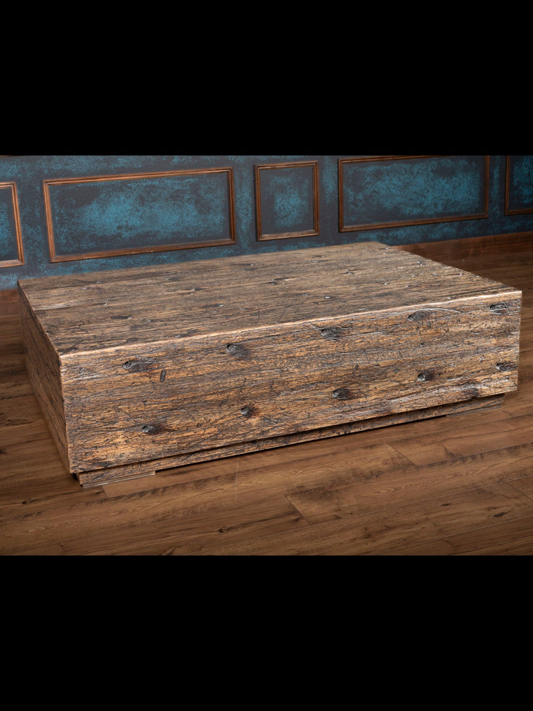 Reclaimed Oak Beam Coffee Table with brown distressed oak wood in spacious rustic interior.