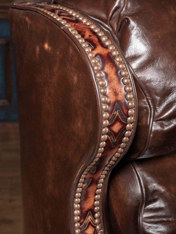 Close-up of burnished full-grain leather texture and natural grain on the recliner